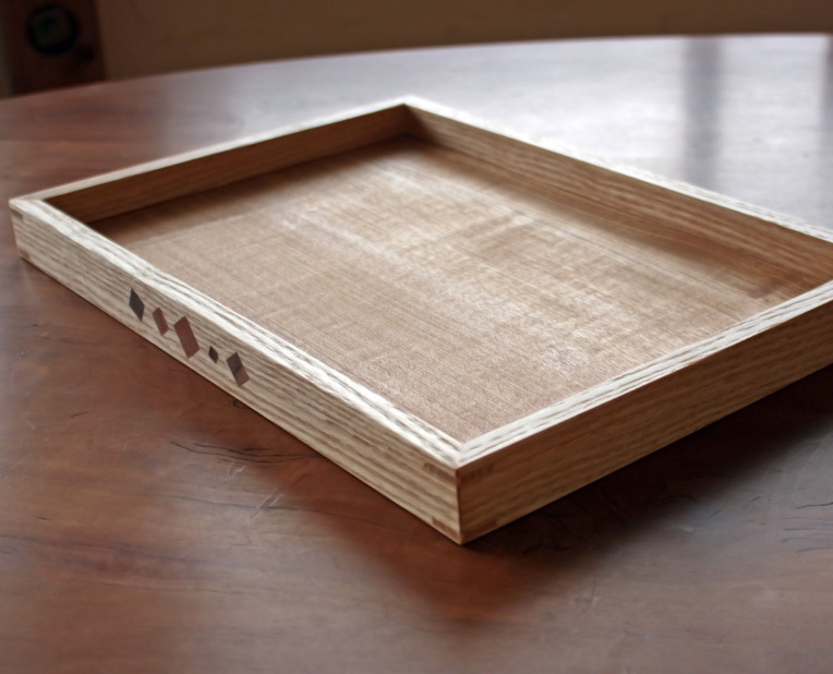 Tray with inlay